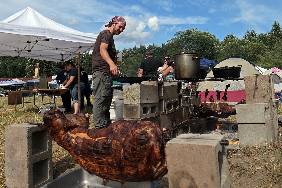 A ram cooks over a fire at Burning Beast. (John Nelson)