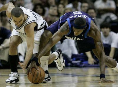 
San Antonio Spurs guard Tony Parker, left, and Dallas Mavericks forward Josh Howard chase down a loose ball. 
 (Associated Press / The Spokesman-Review)