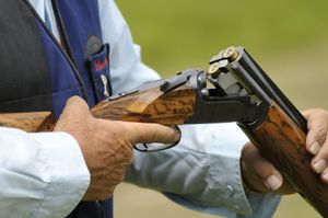 Dave Farley, of Salem,  reloads his shotgun during the Washington State Sporting Clays Championships in June  at Landt Farms. (Dan Pelle / The Spokesman-Review)