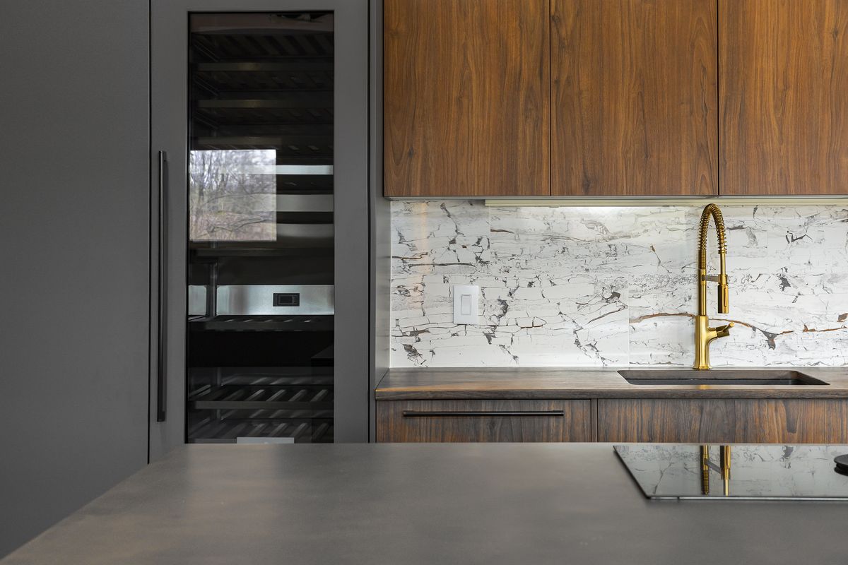 Elements such as a concrete countertops, including one manufactured to mimic wood is highlighted by a ceramic backsplash. (Cathy Hobbs Design Recipes/TNS) (HOBBS/TNS)