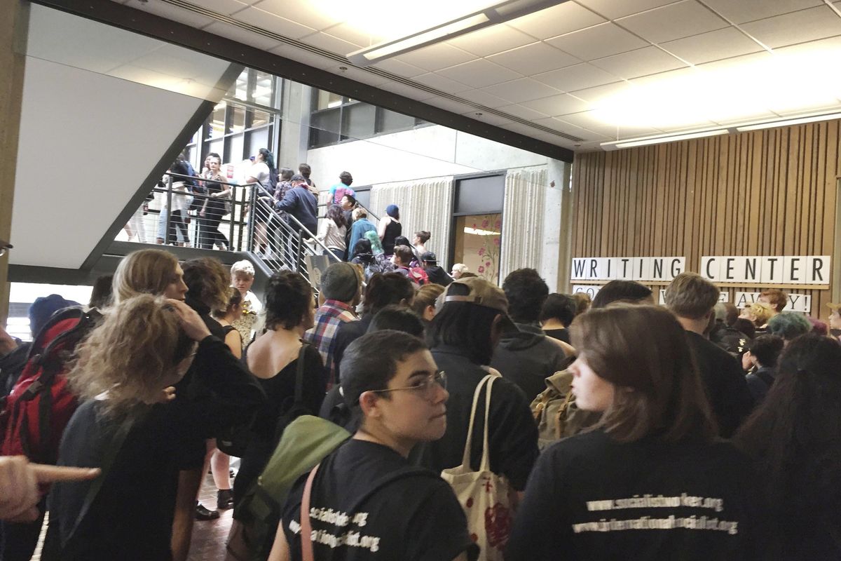 Students leave the Evergreen State College campus in Olympia, Wash., after a threat prompted a student alert and evacuation on Thursday, June 1, 2017. (Lisa Pemberton / Lisa Pemberton/Olympian)