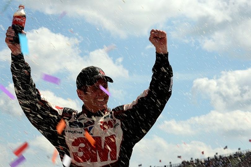 Greg Biffle, driver of the #16 3M/Give Kids a Smile Ford, celebrates in Victory Lane after winning the NASCAR Sprint Cup Series Quicken Loans 400 at Michigan International Speedway on June 16, 2013 in Brooklyn, Michigan. (Photo Credit: John Harrelson/Getty Images) (John Harrelson / Getty Images North America)