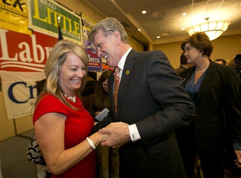 Sherri Ybarra, candidate for superintendent of education, is greeted by Gov. Butch Otter at the Republican election night party, Tuesday Nov. 4, 2014, at the Riverside Hotel in Boise, Idaho. (AP/Idaho Statesman / Darin Oswald)