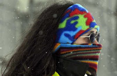 
Playground supervisor Julie Ward keeps her face covered during lunchtime recess Tuesday at Liberty Lake Elementary School. 
 (Liz Kishimoto / The Spokesman-Review)