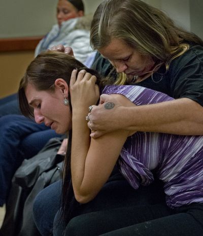 Courtney Turnipseed, a close friend of Spc. Tevin Geike, and her mother, Kimberly Turnipseed, react as Commissioner Meagan Foley releases Cedarium Johnson, 21, without bail and to the supervision of Joint Base Lewis-McChord on Tuesday. Geike was stabbed and died after a confrontation over the weekend. (Associated Press)