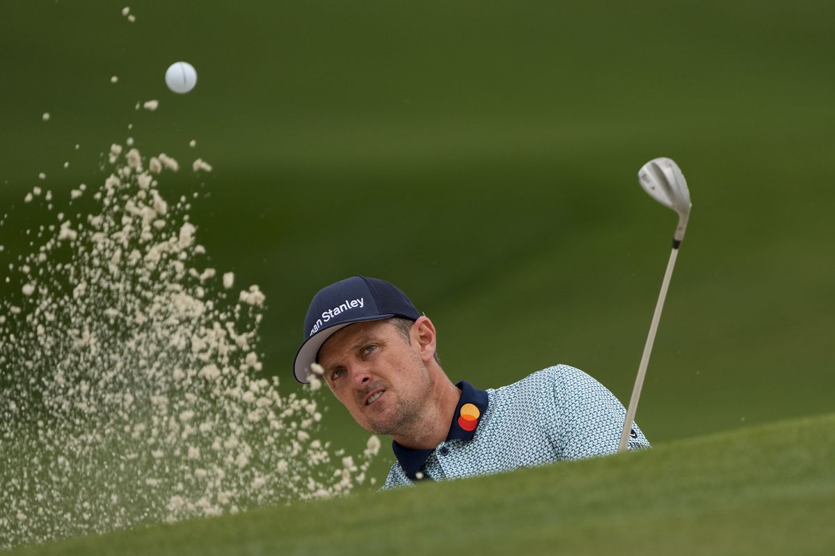 Justin Rose, of England, hits out of a bunker on the seventh hole during the second round of the Masters golf tournament on Friday, April 9, 2021, in Augusta, Ga.  (Associated Press)