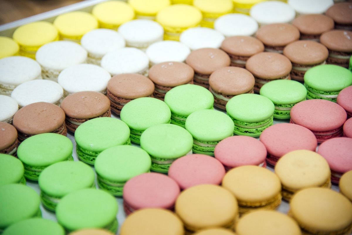 Colorful French macarons fills a tray at Common Crumb, the bakery at Saranac Commons owned by Jeremy and Kate Hansen of Sante. (Jesse Tinsley / The Spokesman-Review)