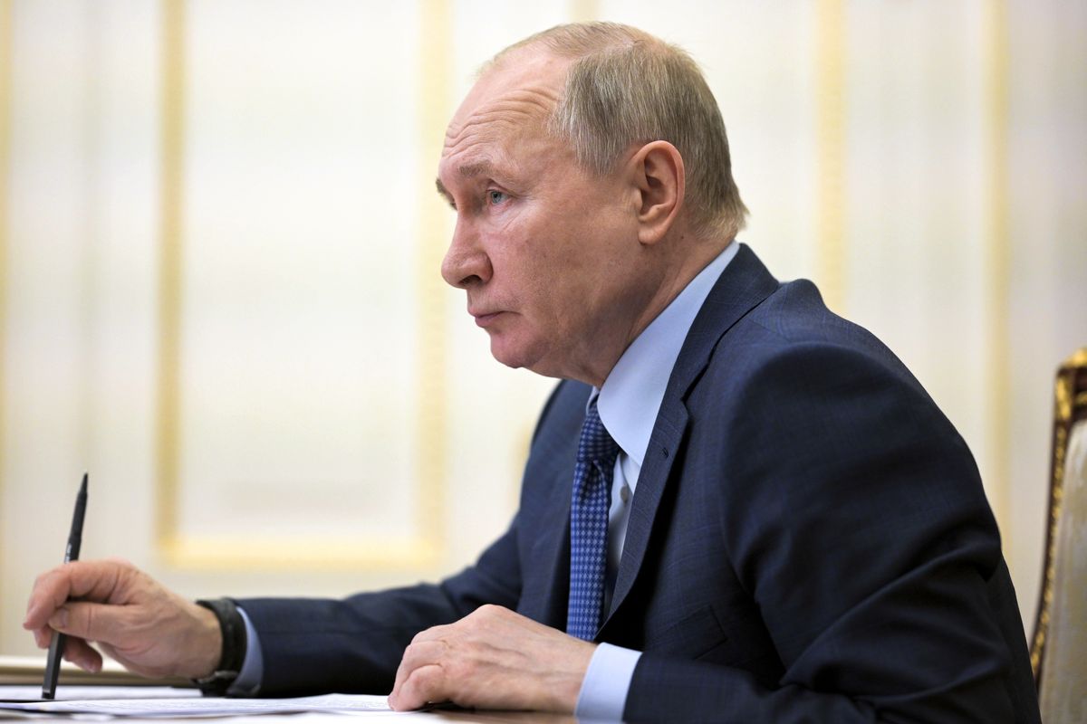 Russian President Vladimir Putin listens during a cabinet meeting via video conference in Moscow, Russia, Thursday, April 8, 2021.  (Alexei Druzhinin)