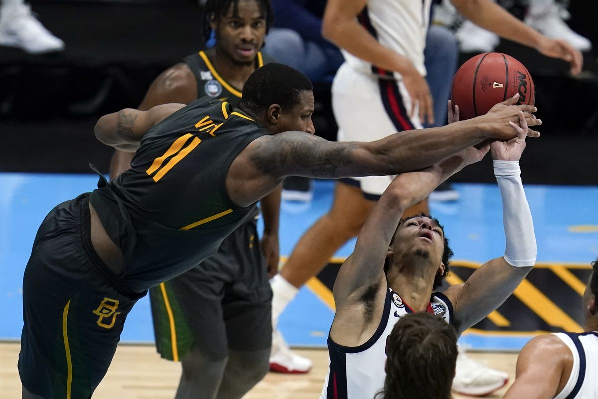 Gonzaga guard Andrew Nembhard is fouled by Baylor guard Mark Vital (11) during the second half of the championship game in the men