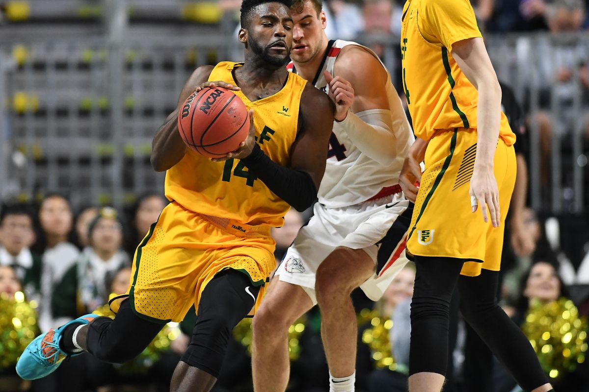 San Francisco Dons guard Charles Minlend (14) reacts as he moves the ball against Gonzaga Bulldogs forward Corey Kispert (24) during the second half of a West Coast Conference semi-final basketball game on Monday, March 9, 2020, at The Orleans in Las Vegas, Nev. Gonzaga won the game 81-77. (Tyler Tjomsland / The Spokesman-Review)