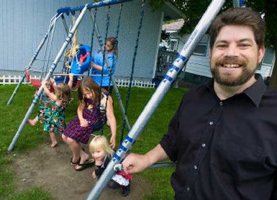 
Rich Hopkins recently won the regional Toastmasters International speaking contest and is headed to the world championships in August. He is shown with his family outside their Spokane home. 
 (Christopher Anderson / The Spokesman-Review)