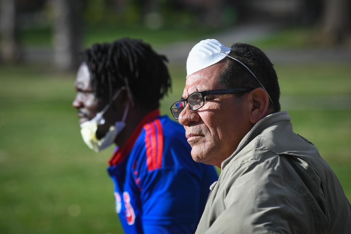 Nicaraguan refugee Silvio Urbina Rojas, right, meets on April 10 in Corbin Park with Cameroon refugee Lewis Nuah. (Dan Pelle / The Spokesman-Review)