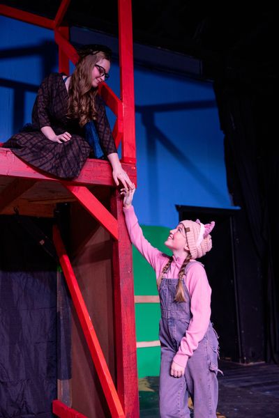 Ana Ingoldby, below, as Wilbur the pig, and Emy Hargrove, as Charlotte, in the Spokane Children’s Theatre production of “Charlotte’s Web.”  (Courtesy)