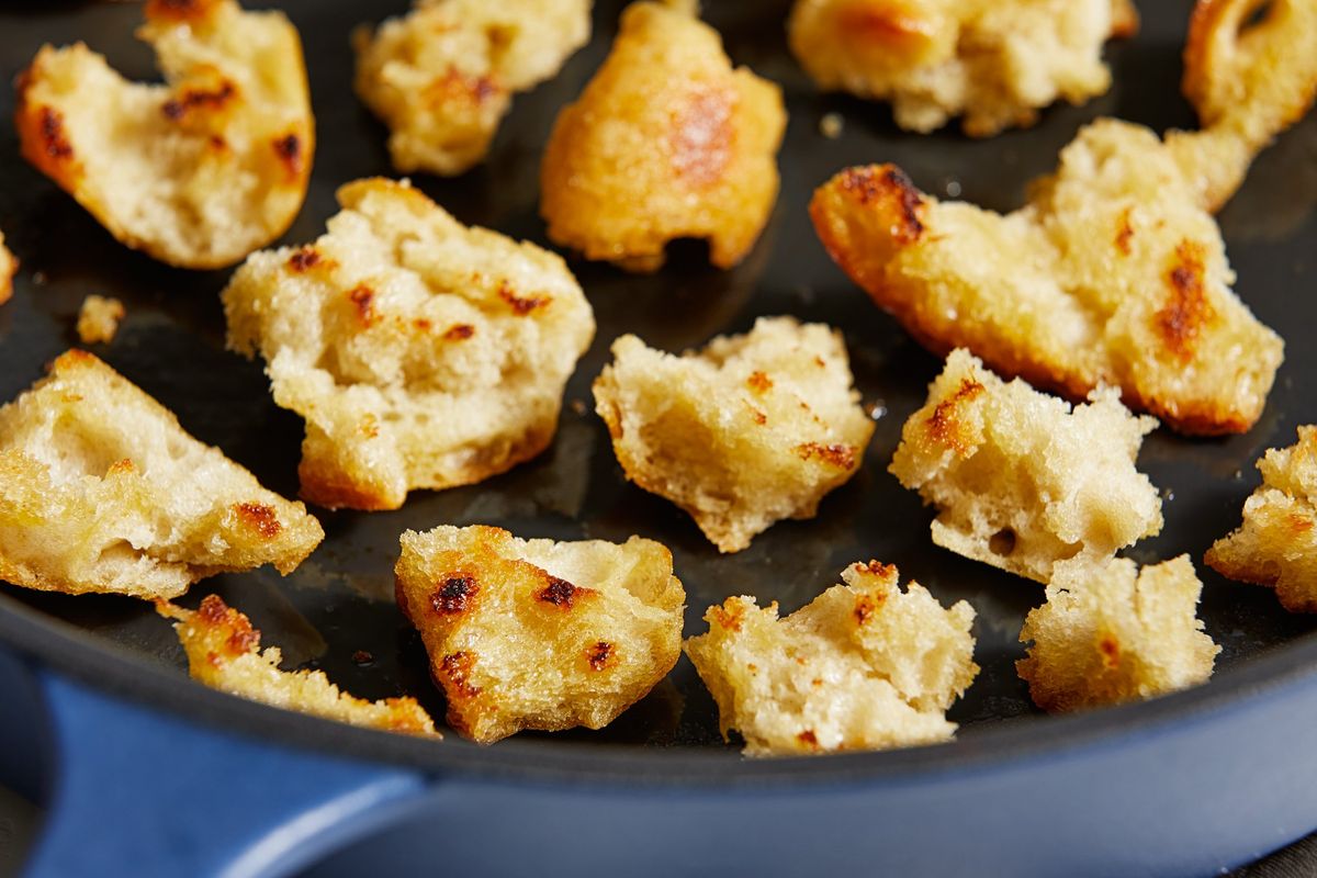 The bread is torn into craggy, bite-size pieces and toasted in olive oil, giving it a golden, crisp luxuriousness. MUST CREDIT: Tom McCorkle for The Washington Post  (Tom McCorkle for The Washington Post/food styling by Gina Nistico for The Washington Post)