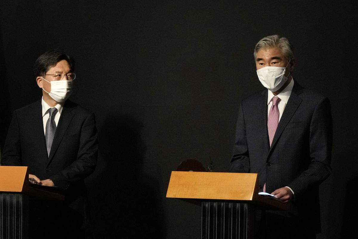 U.S. Special Representative for North Korea, Sung Kim, right, speaks during a briefing after a meeting with South Korea's Special Representative for Korean Peninsula Peace and Security Affairs Noh Kyu-duk at a hotel in Seoul, South Korea, Sunday, Oct. 24, 2021. (Ahn Young-joon)