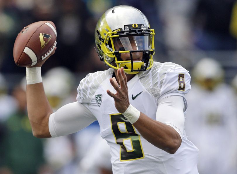 Oregon quarterback Marcus Mariota can get an early start on the 2014 Heisman Trophy race with a good performance in the Alamo Bowl. (Associated Press)