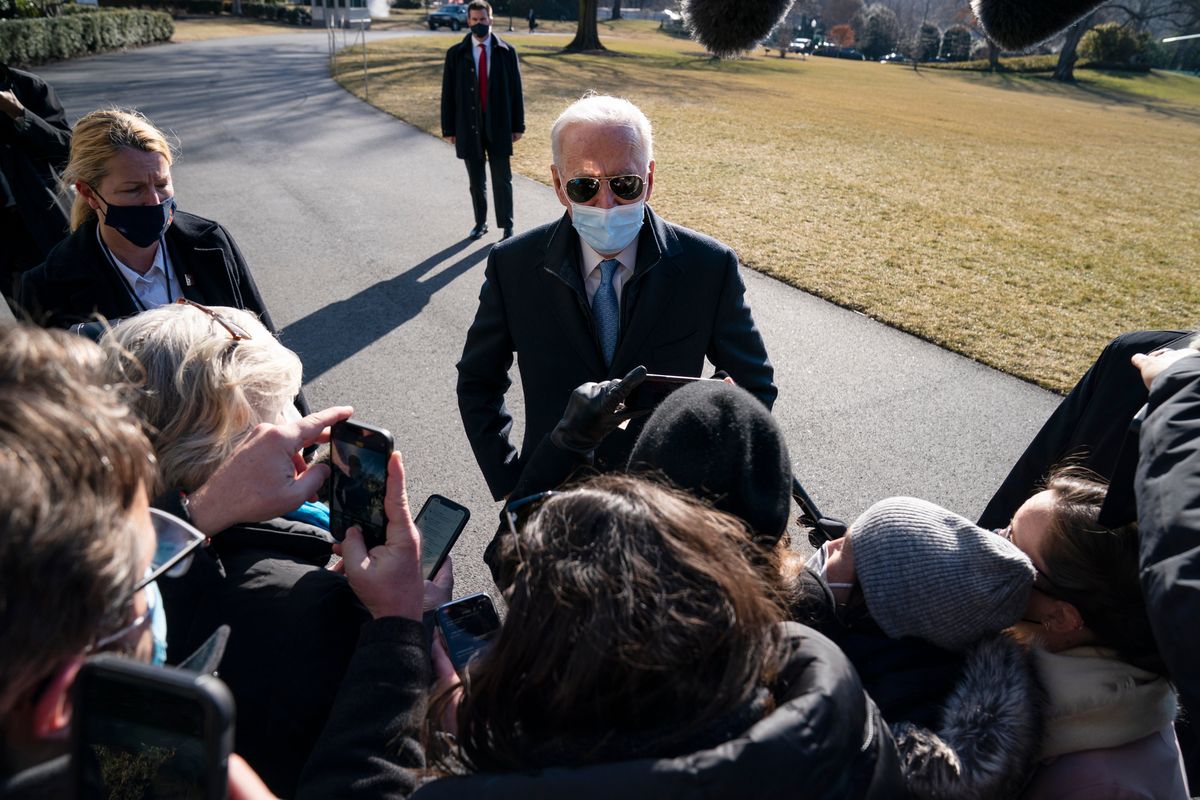 FILE - President Joe Biden talks with reporters after arriving on the South Lawn of the White House, on Feb. 8, 2021, in Washington.  (Evan Vucci)