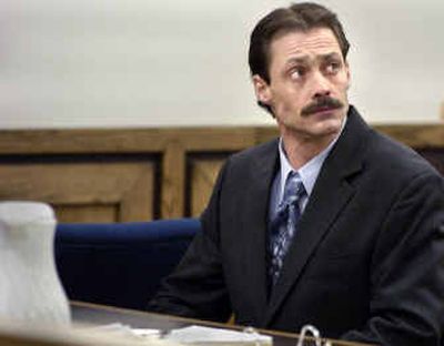 
Guylin Johnston watches as his attorney prepares for the afternoon session in Superior Court on Tuesday. Johnston is accused of sexaully assaulting a patient under his care at Eastern Washington State Hospital. 
 (Christopher Anderson/ / The Spokesman-Review)