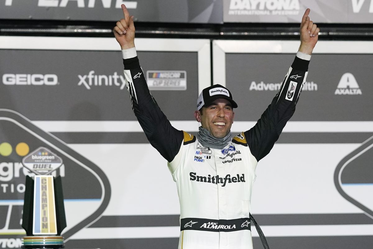 Aric Almirola celebrates in Victory Lane after winning the first of two qualifying NASCAR auto races for the Daytona 500 at Daytona International Speedway, Thursday, Feb. 11, 2021, in Daytona Beach, Fla.  (Associated Press)