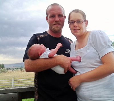 Shawna Uriguen and her fiance, Clay Crown, pose Wednesday in Buhl, Idaho, with their daughter, Kimber Marie Crown. (Associated Press)