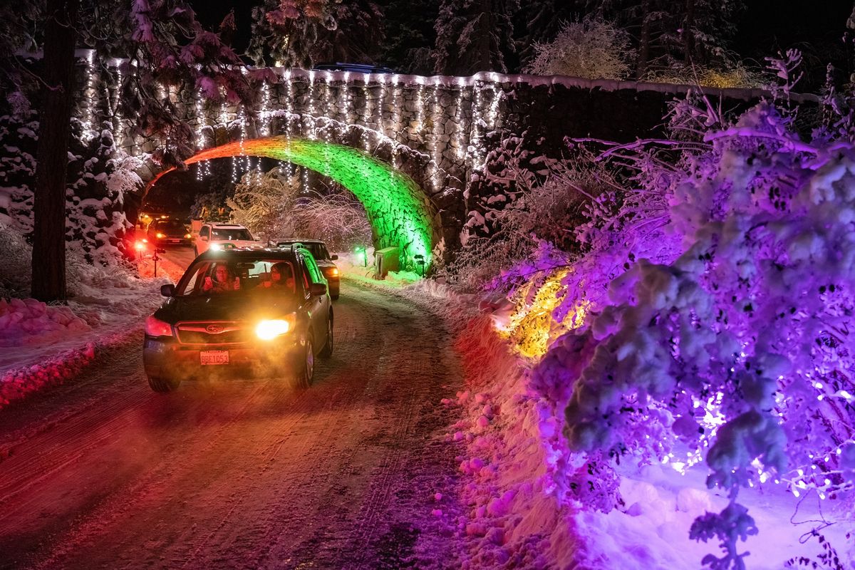Cars snake through the Manito Park Holiday Lights show Friday. The drive-thru show, sponsored by the Friends of Manito, runs Friday to Monday from 6 to 9:30 p.m. The walk-thru only show runs Tuesday through Sunday from 5 to 8 p.m.  (COLIN MULVANY/THE SPOKESMAN-REVI)