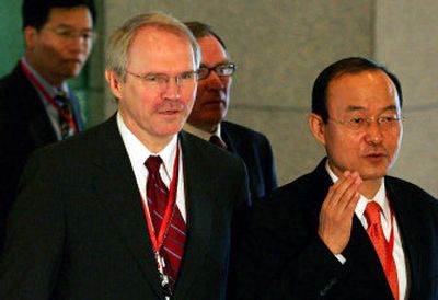 
South Korea diplomat Song Min-soon, right, and U.S. diplomat Christopher Hill walk to the six-party nuclear talks Tuesday in Beijing.
 (Associated Press / The Spokesman-Review)