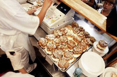 
Plates of cream puffs are ready to be sold at the Wisconsin State Fair last week in West Allis, Wis. 
 (Associated Press / The Spokesman-Review)