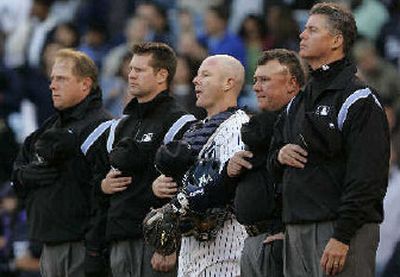 
The New York Yankees observe a moment of silence for former pitcher Steve Howe.
 (Associated Press / The Spokesman-Review)