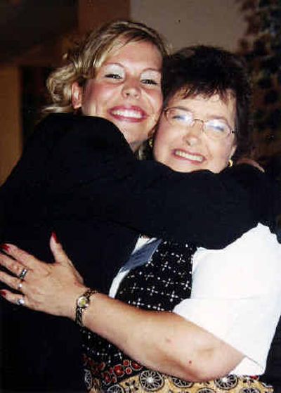 
 Kassi Hays, left, hugs Deborah Mahan at a banquet earlier this month.
 (Photo courtesy of Susan J.Geier / The Spokesman-Review)