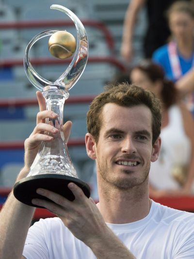 Britain’s Andy Murray raises Rogers Cup trophy following his defeat of Serbia’s Novak Djokovic. (Associated Press)
