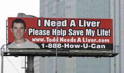 
 One of two billboards asking for help for liver cancer patient Todd Krampitz is shown along a Houston highway in August. 
 (File/Associated Press / The Spokesman-Review)