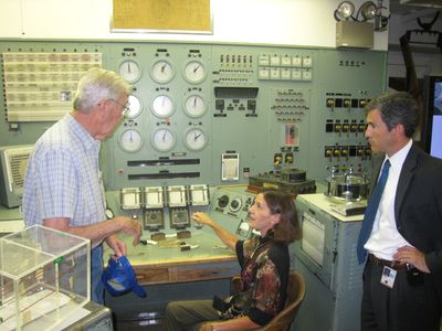 Deputy Secretary of Interior Lynn Scarlett sits at the controls of the B Reactor on Monday as former weapons worker Paul Vinther, left, and Acting Deputy Secretary of Energy Jeffrey Kupfer look on.  (Associated Press / The Spokesman-Review)