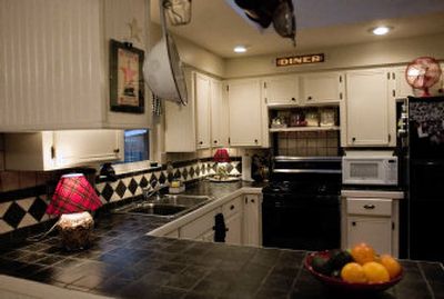
The Johnson family moved into their 1970s rancher and made some major changes. They remodeled the entire kitchen, adding bead board and tile countertops. 
 (Photos by Kathryn Stevens/the Spokesman-Review / The Spokesman-Review)