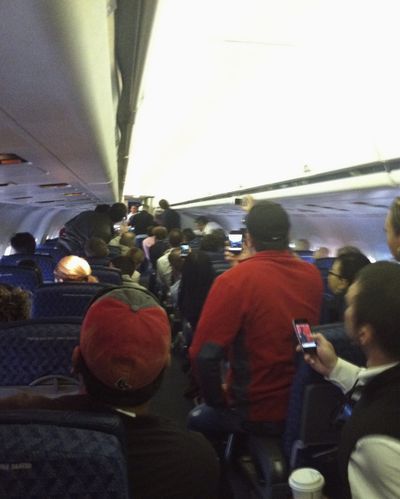 This cellphone photo shows passengers aboard an American Airlines jet during an altercation involving a flight attendant Friday. (Associated Press)