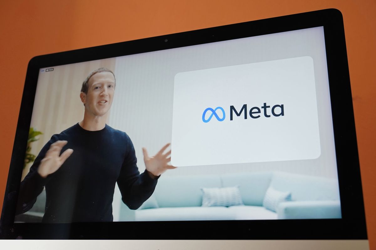 Seen on the screen of a device in Sausalito, Calif., Facebook CEO Mark Zuckerberg announces the company
