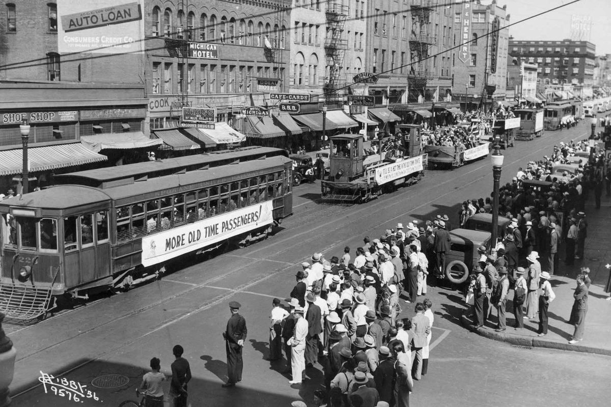 Spokanites are shown bidding farwell to the old streetcars owned by the Spokane United railway system in a parade in August of 1936. (SR)