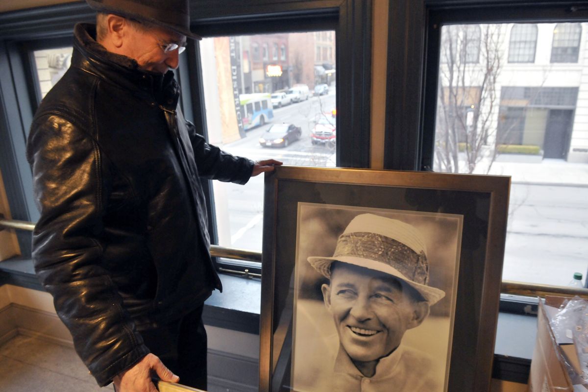 Businessman Jerry Dicker looks at some Bing Crosby memorabilia stored at the Bing Crosby Theater on Dec. 18. Dicker and his wife, Patty, bought the historic 1915 theater and have been updating it with digital projection, video monitors and surround sound audio. (Jesse Tinsley)