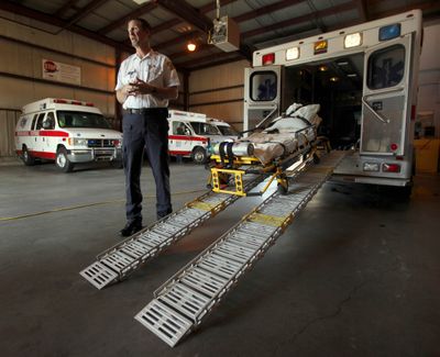American Medical Response official Ken Keller talks about the specially equipped ambulance used for obese patients at the company’s Topeka, Kan., facility.  (Associated Press / The Spokesman-Review)