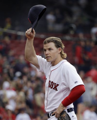 Brock Holt of the Boston Red Sox tips his cap during the Red Sox’ 9-4 victory over Atlanta on Tuesday in Boston. Holt hit for the cycle with a double in the first inning, single in the fifth, home run in the seventh and triple in the eighth. It was the first cycle in the majors this season. (Associated Press)