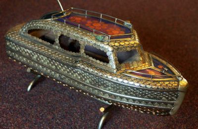 
Marlene Davis was given this model ship made of coins by her grandfather, Emil Johnson. It was modeled after a cabin cruiser he built in San Diego, Calif. 
 (Kathryn Stevens / The Spokesman-Review)