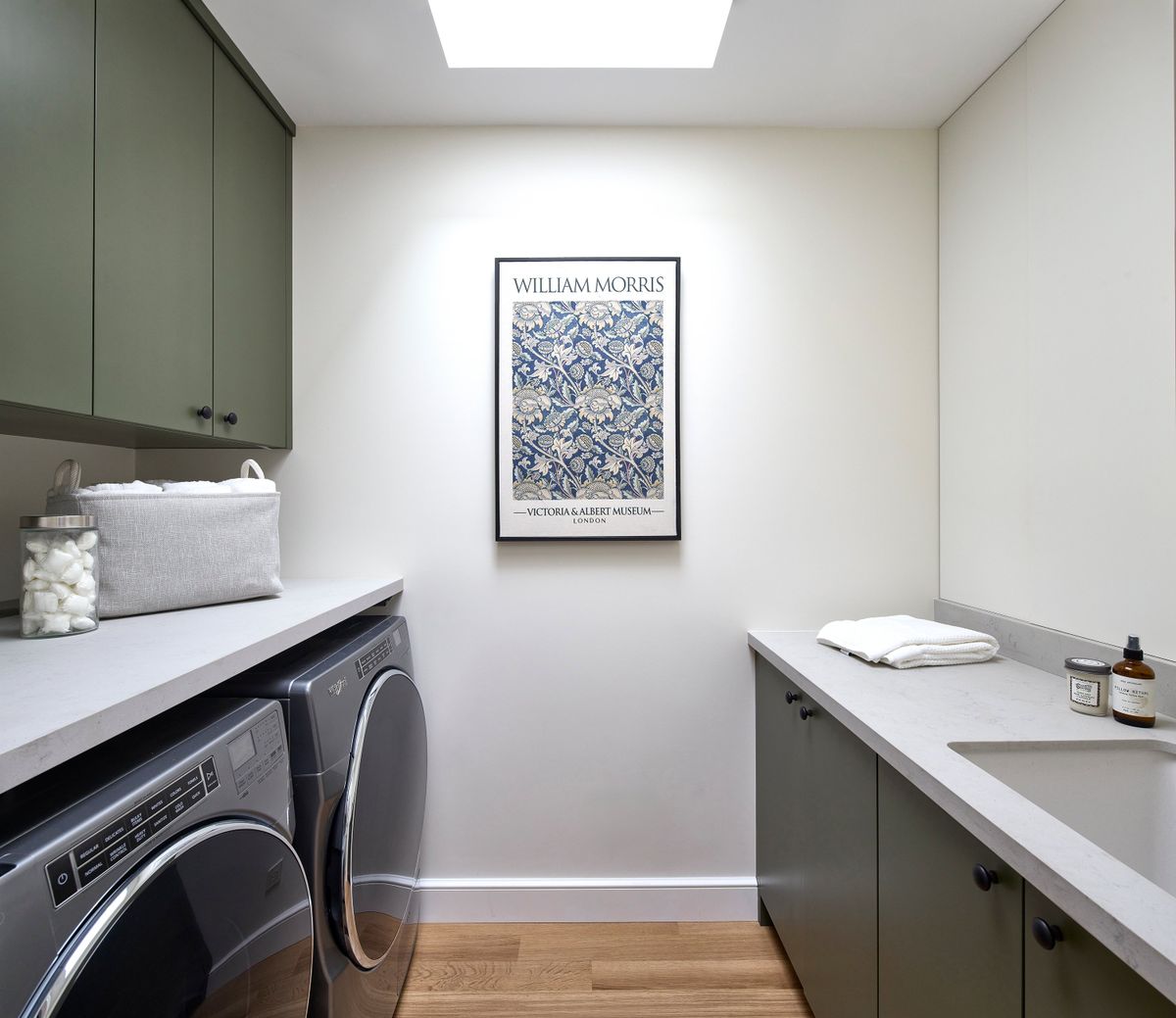 Green cabinets are paired with artwork with hints of green and blue. (Handout/TNS) (TNS)