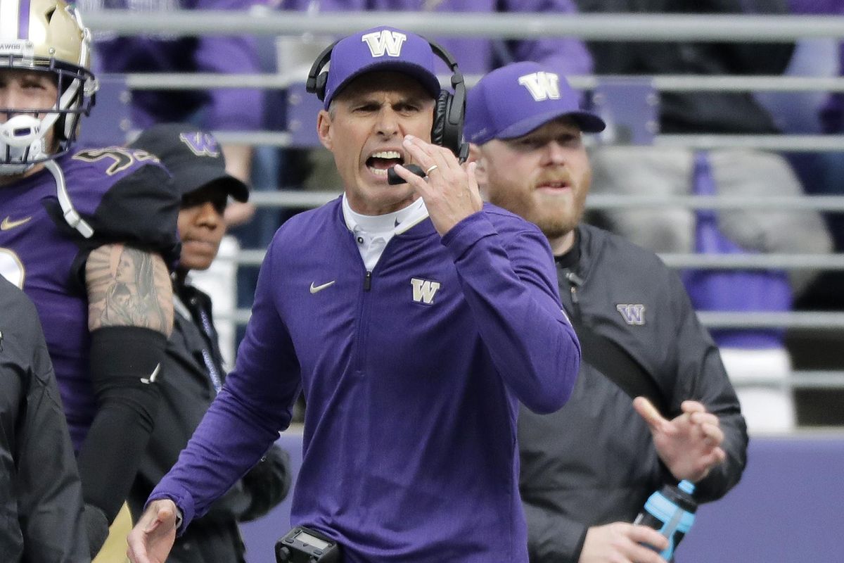 Washington head coach Chris Petersen calls to his team during the first half against Colorado last Saturday in Seattle. (Ted S. Warren / AP)