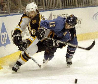 
Right wing Peter Bondra, right, and the Thrashers need a little help if they are to make their first trip to the playoffs. 
 (Associated Press / The Spokesman-Review)