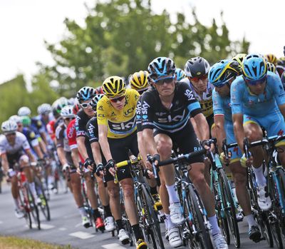Britain's Chris Froome, wearing the overall leader's yellow jersey, rides in the pack Wednesday during the eleventh stage of the Tour de France cycling race over 162.5 kilometers (100.7 miles) with start in Carcassonne and finish in Montpellier, France. (Christophe Ena / Associated Press)