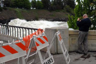 
With a footbridge closed, onlookers found other vantage points. 
 (Larry Reisnouer / The Spokesman-Review)