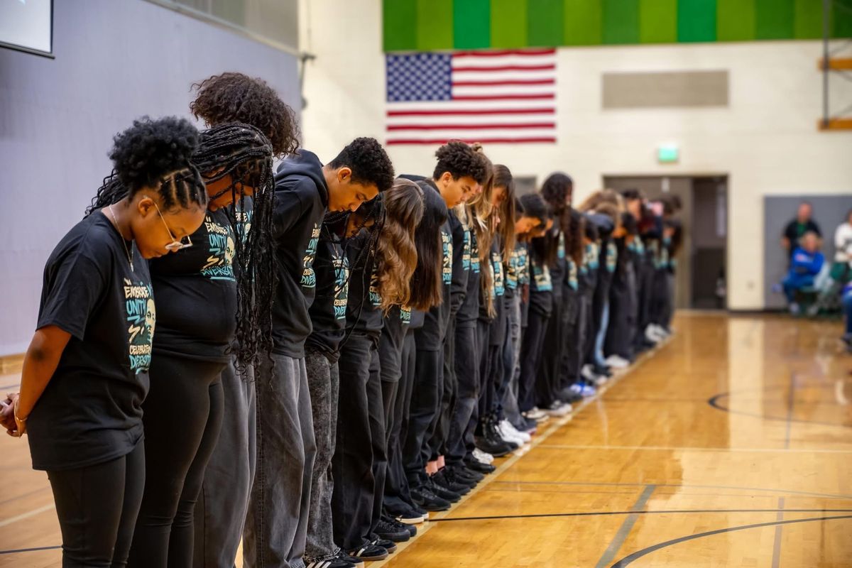 The Salk Middle School Diversity club stands at an assembly.  (Courtesy)