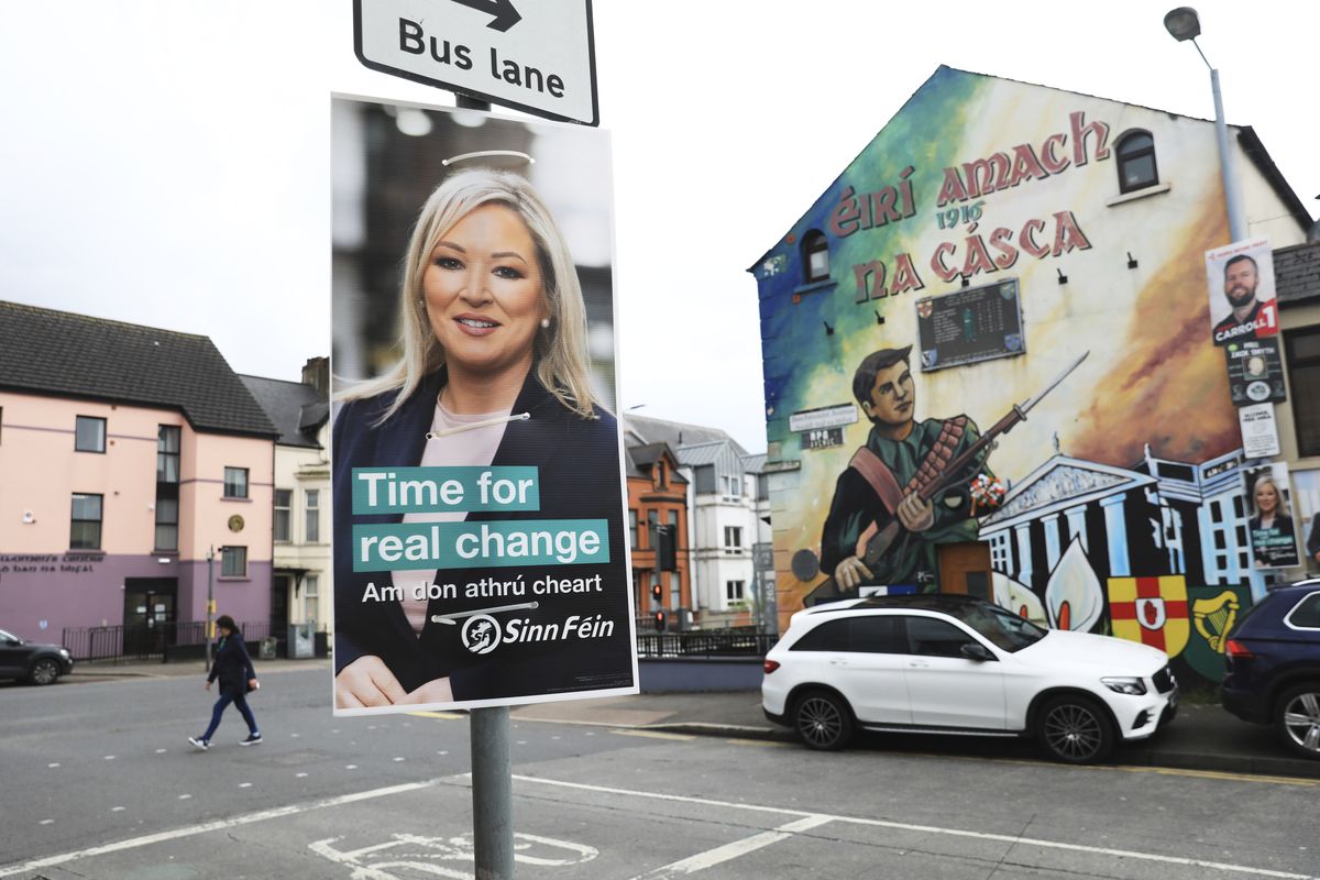 A Sinn Fein election poster hangs from a lamp post in West Belfast, Northern Ireland, Tuesday, May 3, 2022. Sinn Fein, a force in Irish republicanism on both sides of the Irish border looks likely to become the largest party in the assembly, according to polls ahead of the May 5, 2022 local elections.  (Peter Morrison)