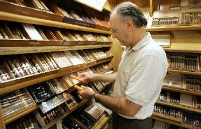 
Gary Bahrenfus, manager of the landmark Edwards Pipe and Tobacco in Tampa, Fla., arranges cigars Wednesday afternoon. Sale of premium cigars is up for the first time since the boom of the late 1990s. 
 (Associated Press / The Spokesman-Review)