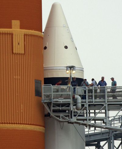 Workers inspect Endeavour’s gaseous hydrogen venting system Monday.  (Associated Press / The Spokesman-Review)