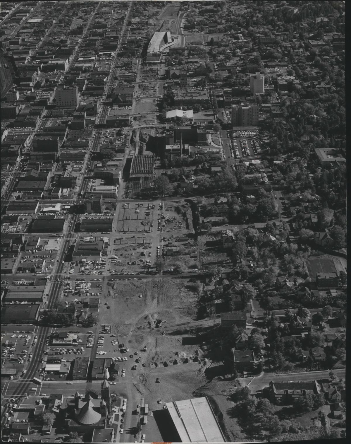 Interstate 90, which cut roughly along Fourth Avenue, was advancing through downtown Spokane in this 1967 photo. At the bottom is Cedar Street and First Presbyterian Church. Northbound and southbound traffic was realigned on the western part of the South Hill as a result of I-90’s construction. Cedar Street had previously been the main arterial on that part of the South Hill to get to downtown until traffic was shifted to Maple and Walnut. (Ed Gilkey / SR)